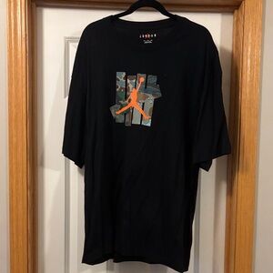 Jordan x Undefeated Black Tee with Camouflage and Orange Logo